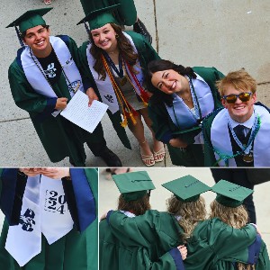 Students in Graduation robes, looking up at the camera